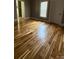 Bedroom features gleaming hardwood floors and natural light from a window at 705 3Rd Nw Ave, Hickory, NC 28601