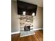 Stone fireplace with hearth and a flat screen TV above at 705 3Rd Nw Ave, Hickory, NC 28601