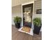 Charming front porch entry featuring a seasonal decoration and welcome mat at 705 3Rd Nw Ave, Hickory, NC 28601