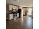 Open kitchen featuring stainless steel appliances, ample cabinetry, and spacious tile flooring at 705 3Rd Nw Ave, Hickory, NC 28601