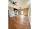 Spacious living room with hardwood floors, two ceiling fans, and a window at 705 3Rd Nw Ave, Hickory, NC 28601