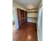 Walk-in closet featuring built-in shelving and hardwood flooring at 705 3Rd Nw Ave, Hickory, NC 28601