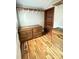 Organized walk-in closet featuring wooden shelving, drawers, and hardwood floors at 705 3Rd Nw Ave, Hickory, NC 28601
