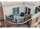 Aerial view showcasing a private outdoor balcony, potted plants, outdoor seating, and urban scenery at 718 W Trade St # 808, Charlotte, NC 28202