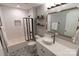 Updated bathroom boasting patterned tile flooring, stylish vanity, bronze fixtures and subway tile shower at 718 W Trade St # 808, Charlotte, NC 28202