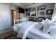 Cozy bedroom showcasing a white bed frame, a gallery wall with art, and a comfortable rug at 718 W Trade St # 808, Charlotte, NC 28202