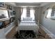 Bedroom featuring white bedding, a cowhide rug, eclectic decor, and eye-catching draperies at 718 W Trade St # 808, Charlotte, NC 28202