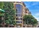Modern condo building exterior highlighting the corner unit with large windows and balconies at 718 W Trade St # 808, Charlotte, NC 28202