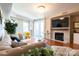 Inviting living room features a stone fireplace, hardwood floors, and stylish decor at 718 W Trade St # 808, Charlotte, NC 28202
