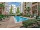 Relaxing outdoor pool with lounge chairs in a courtyard setting at 718 W Trade St # 808, Charlotte, NC 28202