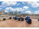 A beautiful rooftop terrace with comfortable lounge seating and city skyline views at 718 W Trade St # 808, Charlotte, NC 28202