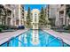 Inviting rectangular swimming pool surrounded by landscaped gardens in a well-maintained community at 718 W Trade St # 808, Charlotte, NC 28202
