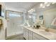 Main bathroom features a glass-enclosed shower, double vanity, and neutral finishes at 7204 Hodges Meadow Ln, Charlotte, NC 28213