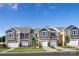 Charming townhomes featuring attached garages, neutral color schemes, and well-manicured lawns at 7204 Hodges Meadow Ln, Charlotte, NC 28213