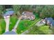 Expansive aerial view of a well-manicured property with a long driveway and lush greenery at 7268 Kiskadee Dr, Denver, NC 28037