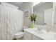 Clean bathroom featuring a white vanity, a large mirror, and a shower with white patterned curtain at 7268 Kiskadee Dr, Denver, NC 28037