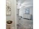 Open bedroom with a dresser, painting, ceiling fan, and carpeted floor at 7268 Kiskadee Dr, Denver, NC 28037