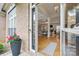 Open entryway view into the bright living space featuring hardwood floors and tray ceilings at 7268 Kiskadee Dr, Denver, NC 28037