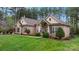 Well-maintained brick home with a lush green lawn and a welcoming facade at 7268 Kiskadee Dr, Denver, NC 28037
