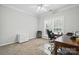 Functional home office with a desk, office chair, and a large window allowing natural light at 7268 Kiskadee Dr, Denver, NC 28037
