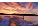 Exciting watersport activity on a lake at sunset with vibrant colors reflecting on the water at 7268 Kiskadee Dr, Denver, NC 28037