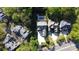 Aerial view of a home featuring a pool, outdoor entertaining area, and lush landscaping in a desirable neighborhood at 7944 Park Rd, Charlotte, NC 28210