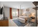 Well-lit bedroom showcasing textured wall design, stylish furnishings, and a cozy ambiance at 7944 Park Rd, Charlotte, NC 28210