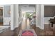 Spacious foyer with hardwood floors leading to open living spaces, creating an inviting and seamless transition throughout the home at 7944 Park Rd, Charlotte, NC 28210
