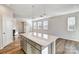 Island kitchen with white countertop, gray cabinetry, and pendant lighting fixtures at 8042 Downy Oak Ln, Charlotte, NC 28269