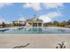 Community pool with lounge chairs, pool house and clear blue skies at 8042 Downy Oak Ln, Charlotte, NC 28269