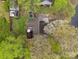 Aerial perspective of home with lush surroundings, backyard and tree blossom canopy at 813 Deer Path Pl, Mooresville, NC 28115