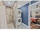 Modern bathroom with tiled shower and convenient in-unit washer and dryer at 813 Deer Path Pl, Mooresville, NC 28115