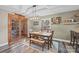 Cozy dining area featuring a wooden table, bench, and rustic light fixture at 813 Deer Path Pl, Mooresville, NC 28115