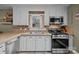 Well-equipped kitchen featuring stainless steel appliances and bright white cabinetry at 813 Deer Path Pl, Mooresville, NC 28115