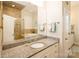 Bathroom with a double vanity, granite countertop, and a view of the shower and tub at 9514 Wheatfield Rd, Charlotte, NC 28277