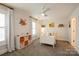 Neutral bedroom with white furniture, bright window light, and grey carpet at 9514 Wheatfield Rd, Charlotte, NC 28277