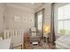 Bedroom with hardwood floors, and a large sunny window at 9514 Wheatfield Rd, Charlotte, NC 28277