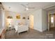 Comfortable bedroom featuring neutral carpet, white trim, and great natural light at 9514 Wheatfield Rd, Charlotte, NC 28277