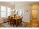 Breakfast nook with hardwood floors, and a large sunny window at 9514 Wheatfield Rd, Charlotte, NC 28277