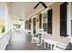 Spacious front porch showcasing elegant lighting, comfortable seating, and a refined aesthetic at 9514 Wheatfield Rd, Charlotte, NC 28277