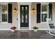 Charming front porch featuring a stylish entrance, sconces, and comfortable seating at 9514 Wheatfield Rd, Charlotte, NC 28277