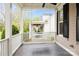 Serene front porch featuring a hanging swing, classic design, and inviting ambiance at 9514 Wheatfield Rd, Charlotte, NC 28277