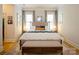 Large main bedroom with hardwood floors, big windows, and luxury comforter at 9514 Wheatfield Rd, Charlotte, NC 28277