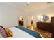 Bright main bedroom with a ceiling fan and view to other rooms in the home at 9514 Wheatfield Rd, Charlotte, NC 28277