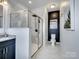 A stylish bathroom with a sleek vanity, a frameless glass shower and black accents offering modern elegance at 9710 Ainslie Downs St, Charlotte, NC 28273