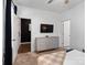 Bright bedroom showcases a neutral color palette, a dresser, and ample closet space for comfortable living at 9710 Ainslie Downs St, Charlotte, NC 28273