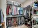 Organized walk-in closet with ample shelving, hanging space, and storage for shoes and accessories at 9710 Ainslie Downs St, Charlotte, NC 28273