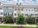 Charming multi-story townhomes featuring neutral siding and manicured landscaping, with inviting curb appeal at 9710 Ainslie Downs St, Charlotte, NC 28273