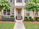 Inviting entryway showcasing a well-maintained facade with lush landscaping and a welcoming front door with wreath at 9710 Ainslie Downs St, Charlotte, NC 28273