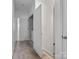 Bright hallway leading to a laundry room, stairs, and other rooms, enhancing the home's flow at 9710 Ainslie Downs St, Charlotte, NC 28273